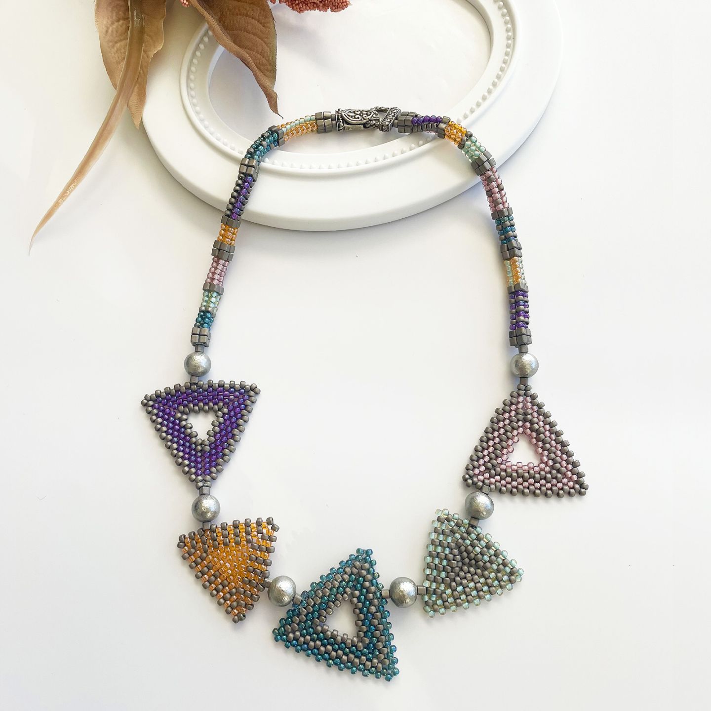 トリアンゴロ パズルネックレス/パステル