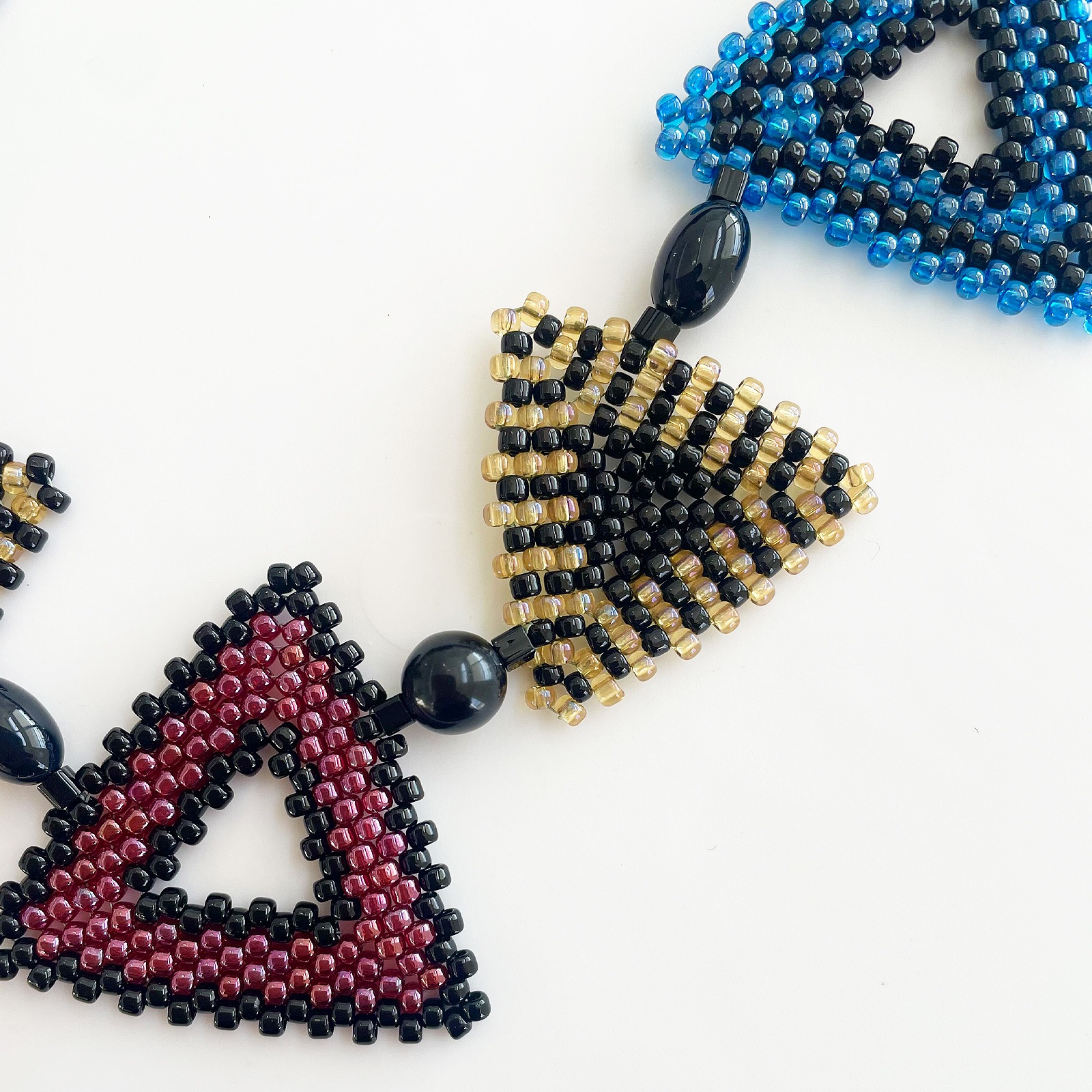 トリアンゴロ パズルネックレス/ステンド