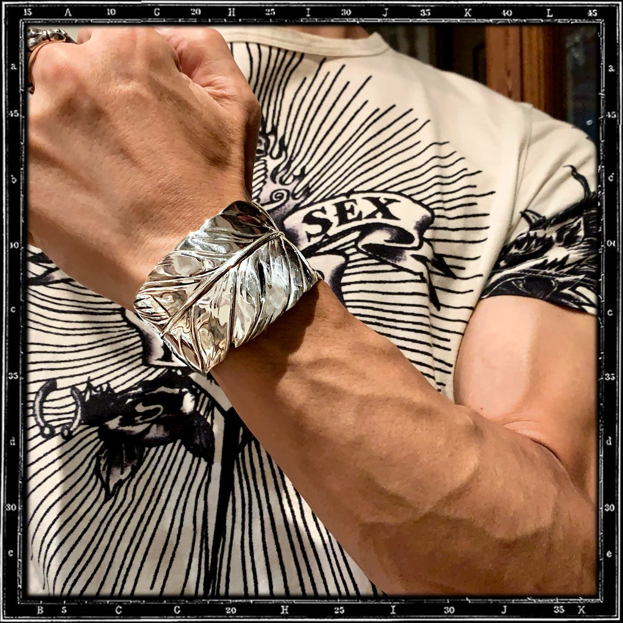 FEATHER BANGLE BRACELET