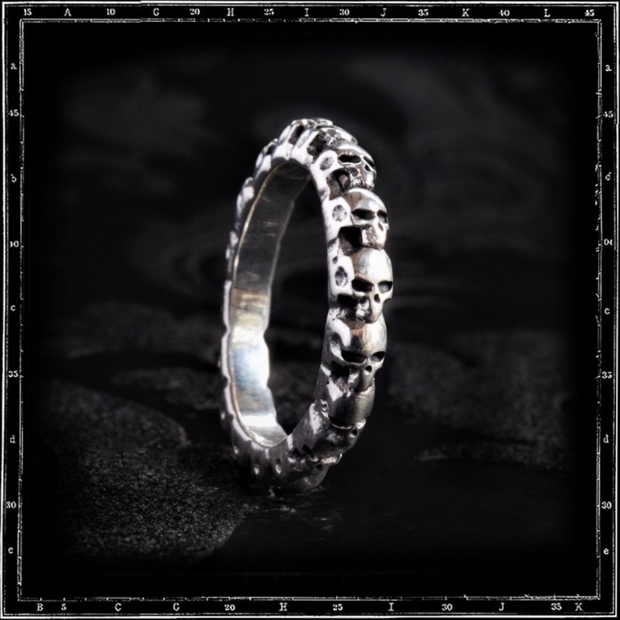 ETERNITY BAND OF SKULLS RING