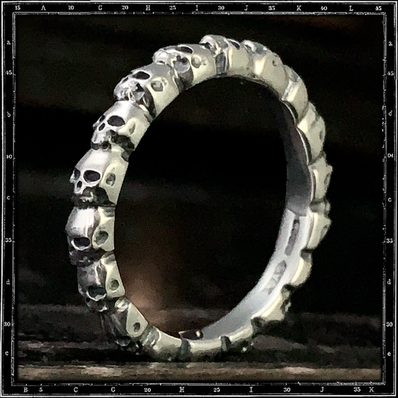 ETERNITY BAND OF SKULLS RING