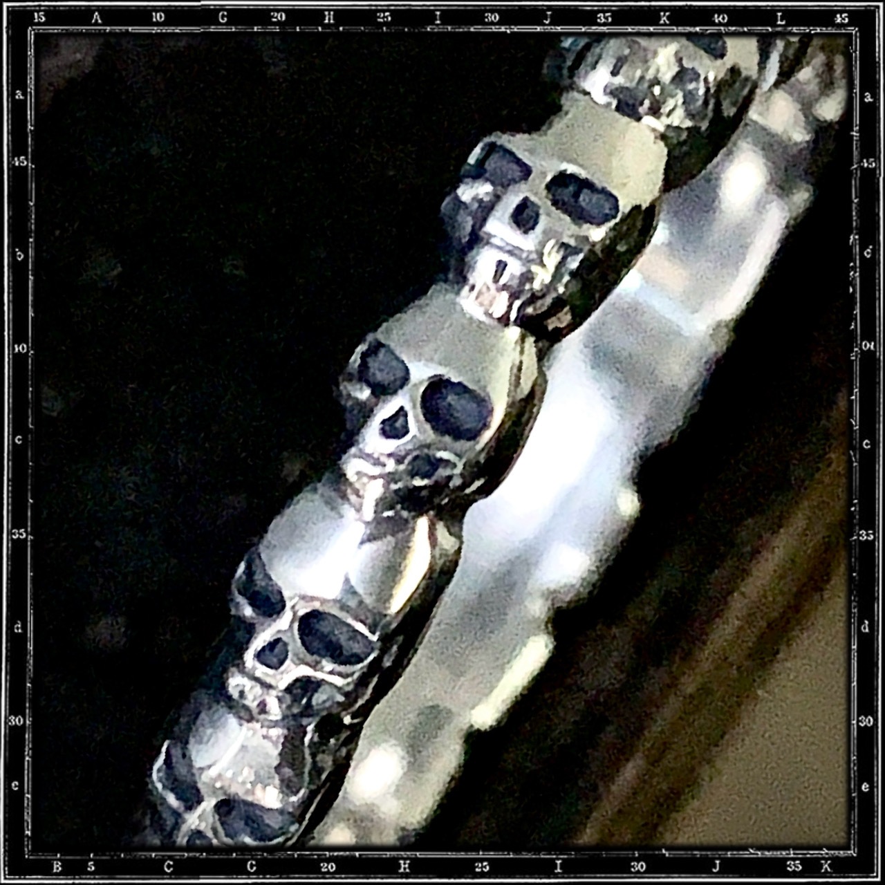 ETERNITY BAND OF SKULLS RING
