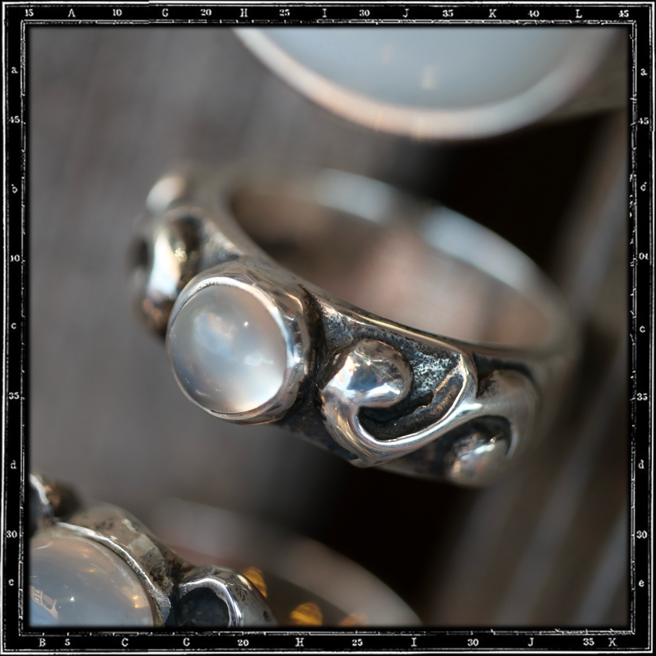 TWO SCROLLS STONE RING