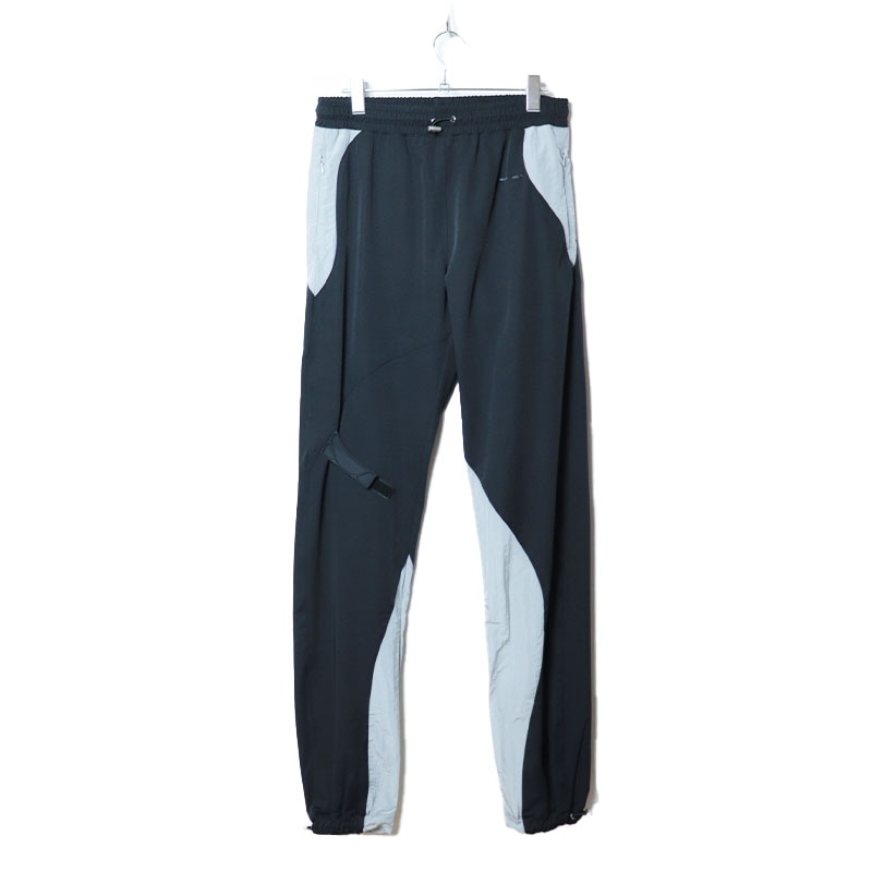 HELIOT EMIL / HE RUBBER STRAP TRACK PANTS