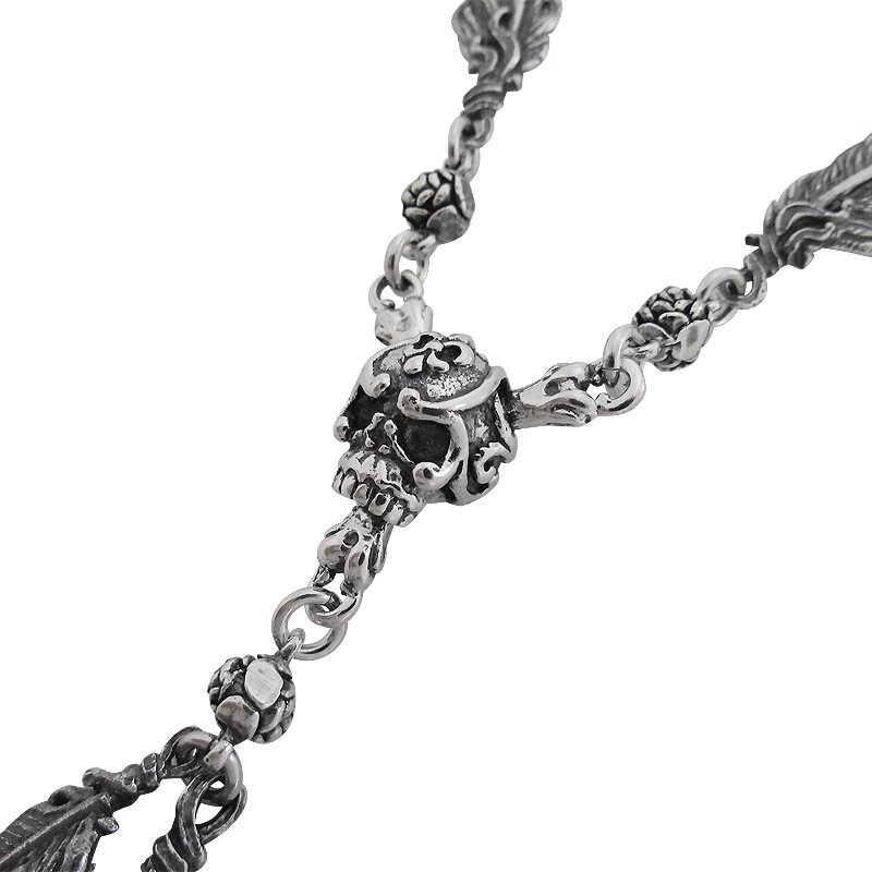 CARVED SKULL & BONES WITH FEATHERS NECKLACE