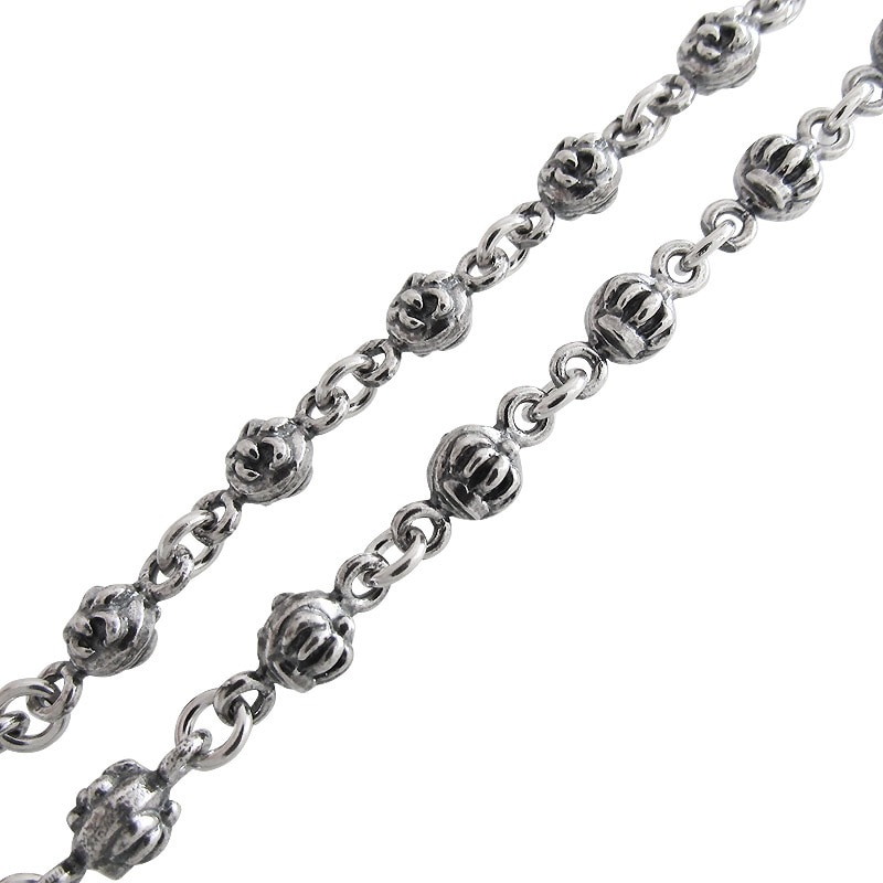 CARVED SKULL & BONES WITH FEATHERS NECKLACE