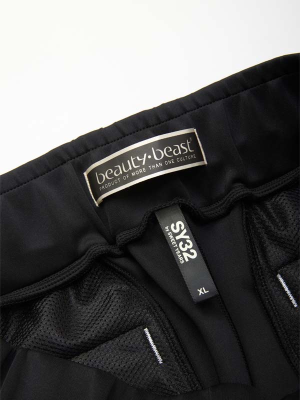 SY32xb:b COLLABORATION PANTS