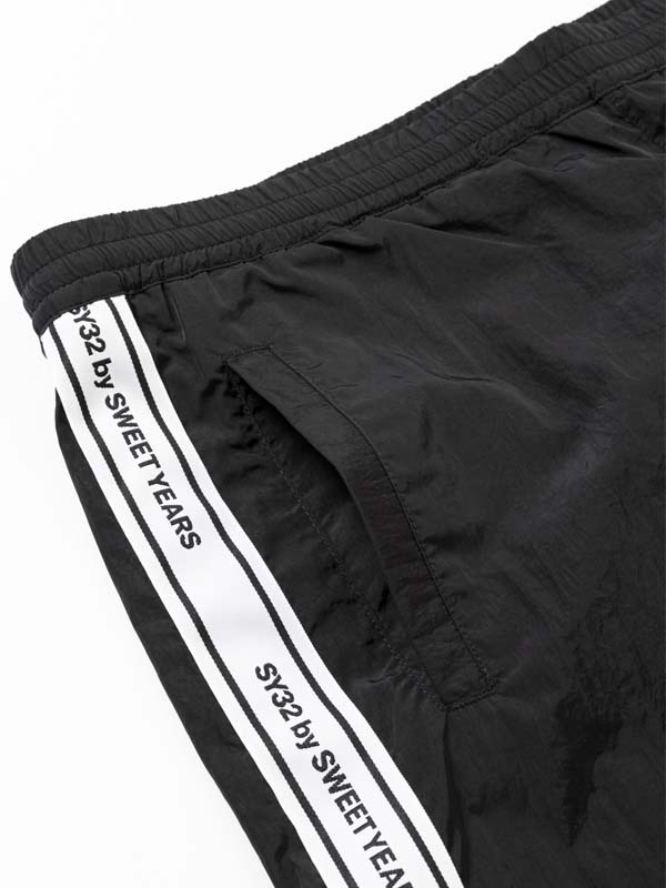 TAPE DESIGN NYLON PANTS