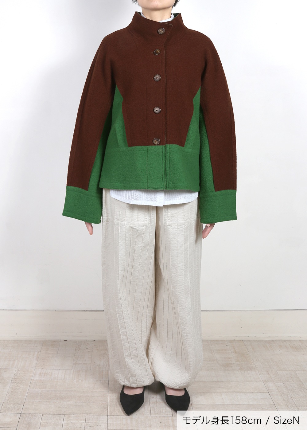 圧縮ニットハイネック裾切り替えジャケット