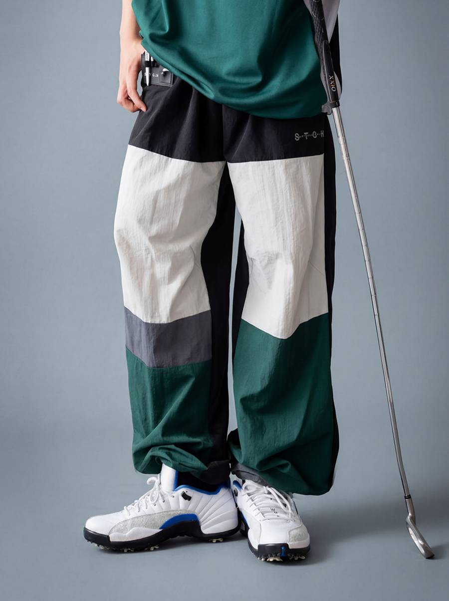 ANTIQUA GOLF×STCH パンツ メンズ 速乾 ナイロン ゴルフ 配色 ワイド