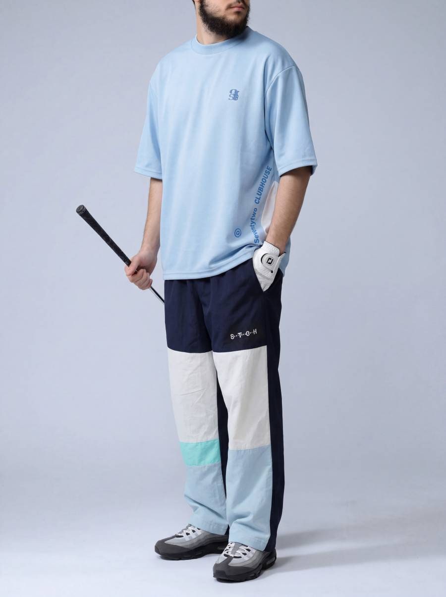 ANTIQUA GOLF×STCH パンツ メンズ 速乾 ナイロン ゴルフ 配色 ワイド