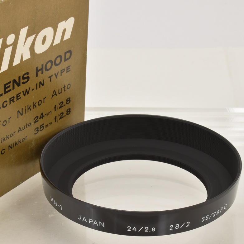 Nikon Ai Nikkor 24mm f2.8 HN-2フード付 中古カメラ機材の通販専門店 Antiquary（アンティクアリィ）