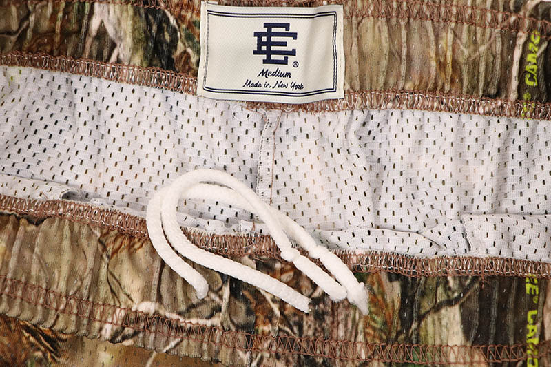 ERIC EMANUEL EE BASIC CAMO WITH BLACK & ORANGE LIGHTNING SHORTS