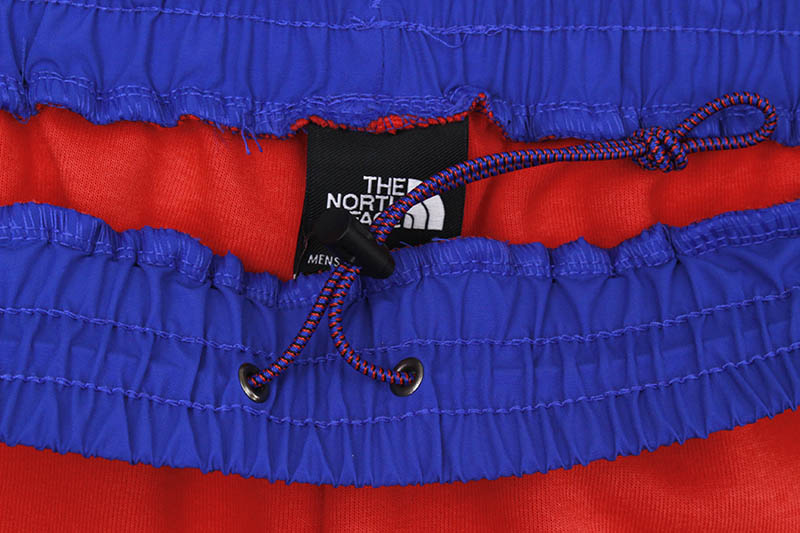 THE NORTH FACE TECH SHORT (HORIZON RED/TNF BLUE)