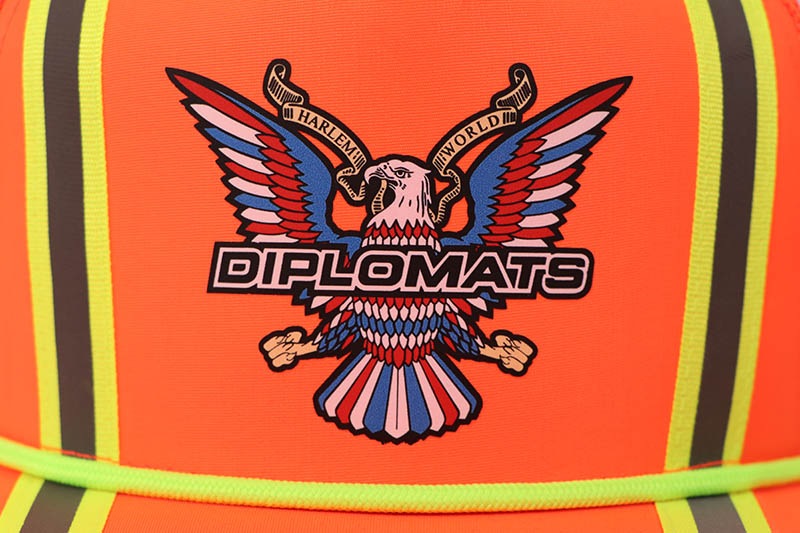 JOMO GLOBAL | THE DIPLOMATS TRUCKER HAT (ORANGE)