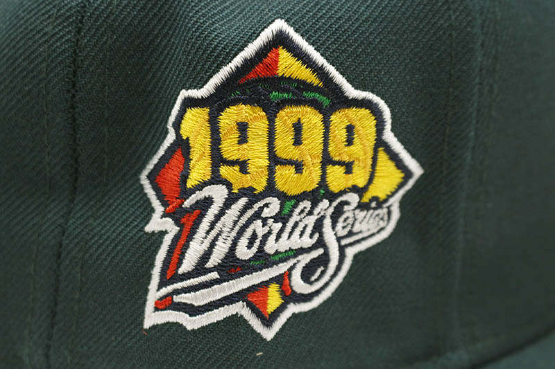 NEW ERA NEW YORK YANKEES 59FIFTY FITTED CAP (1999 WORLD SERIES SIDE PATCH/PINK UNDER VISOR/DARK GREEN)