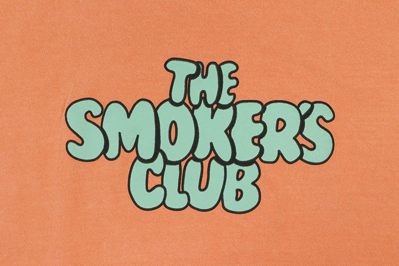THE SMOKER'S CLUB STACKED BUBBLE LOGO FLIP TEE (CORAL)