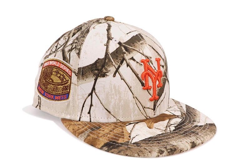 NEW ERA NEW YORK METS 59FIFTY FITTED CAP (1969 WORLD SERIES SIDE PATCH/ORANGE UNDER VISOR/REALTREE SNOW CAMO)