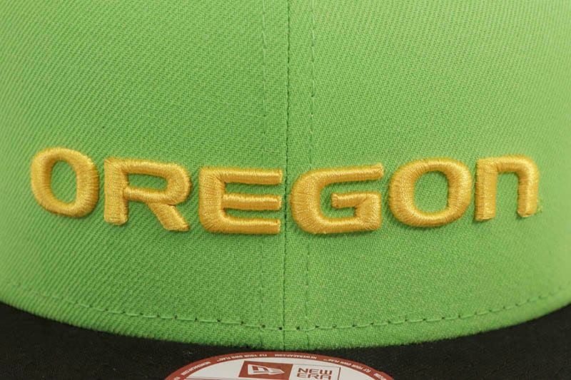 NEW ERA OREGON DUCKS 9FIFTY SNAPBACK CAP (DUCKS SIDE PATCH/GREY UNDER VISOR/LIME BLACK)