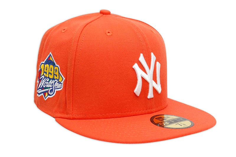 NEW ERA NEW YORK YANKEES 59FIFTY FITTED CAP (1999 WORLD SERIES SIDE PATCH/PINK UNDER VISOR/ORANGE)