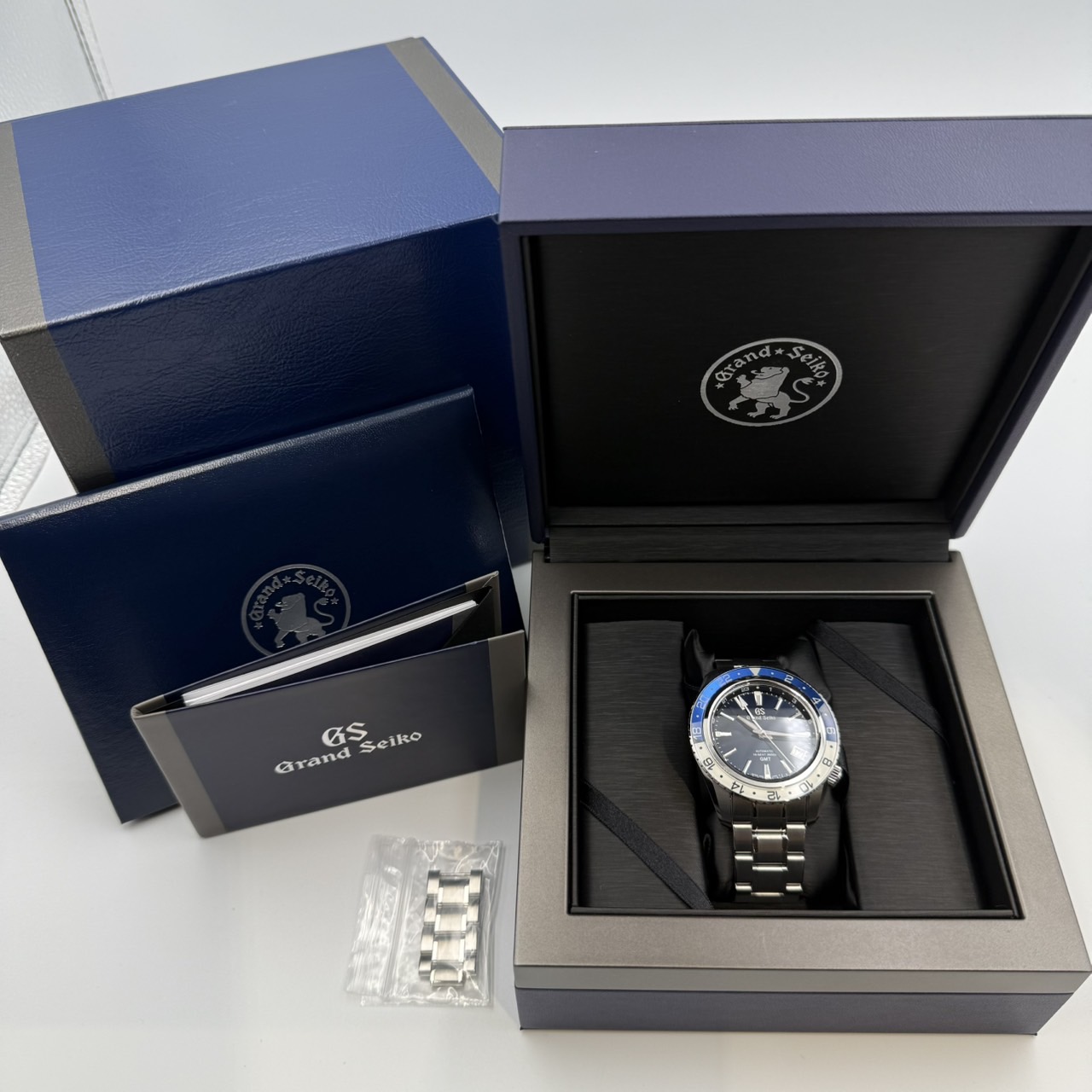 GRAND SEIKO(�����ɥ�������) �ᥫ�˥���ϥ��ӡ��� 36000 GMT SBGJ237 �ߥåɥʥ��ȥ֥롼 ������� ���ض�Ź ST-277