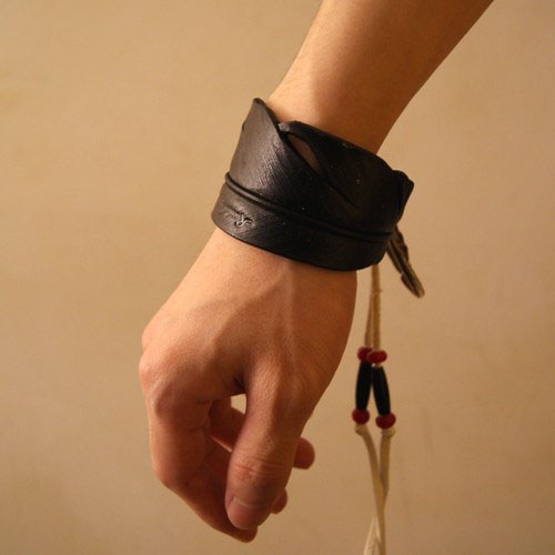 Carved Leather Feather Bangle