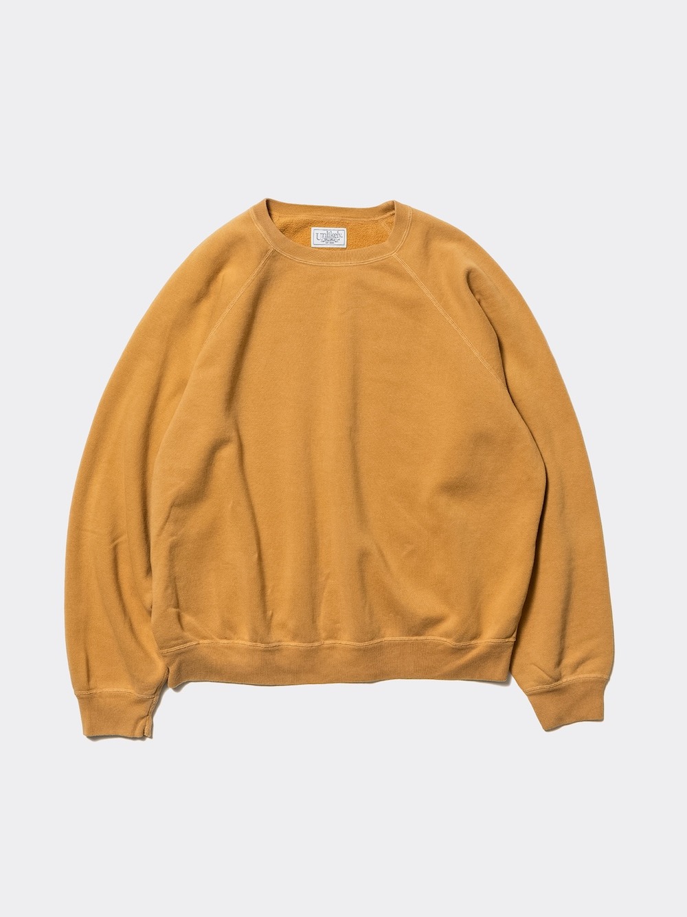 Unlikely(アンライクリー) Raglan Sleeve Crew
