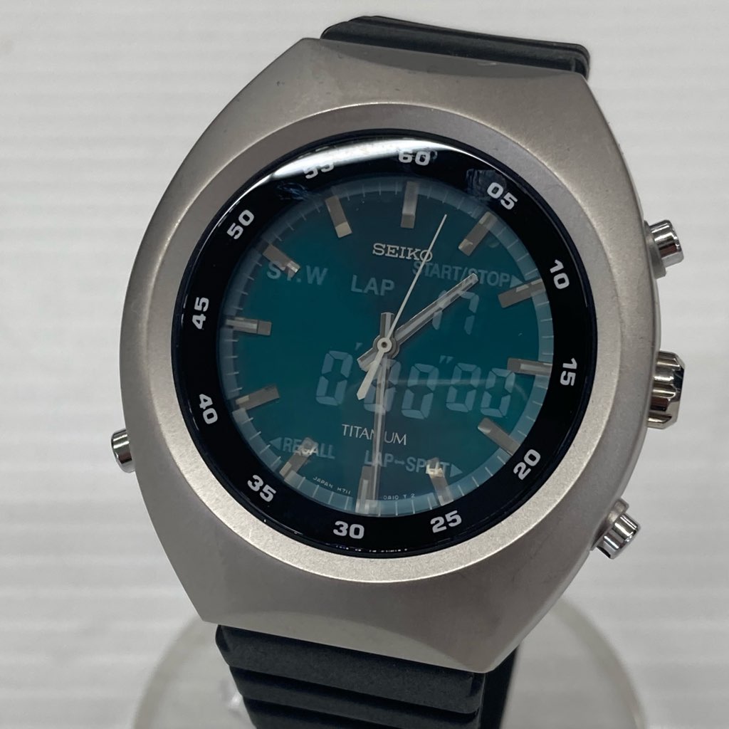 中古 SEIKO TITANIUM H711-0A10 ブルーグリーン系 ベゼル径約