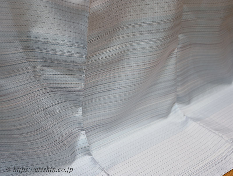 下井伸彦 下井紬・熨斗目調絵羽(白菫色に濃淡の藍/まるまなこ織)「着物と帯・呉服えり新」