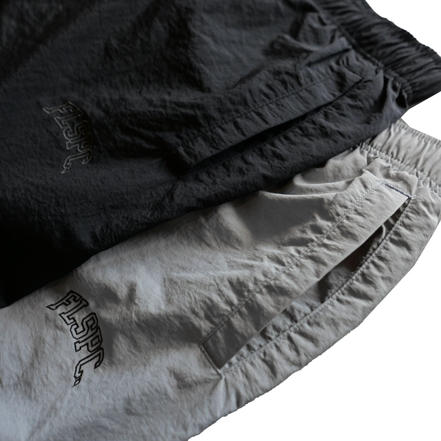 FLSPC. : NYLON PANTS 