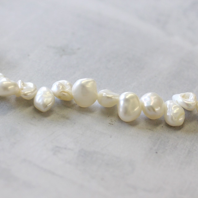 80WKS57WH 淡水パールビーズ ケシ ホワイト 約5×7mm 約20cm 1連 - 卸