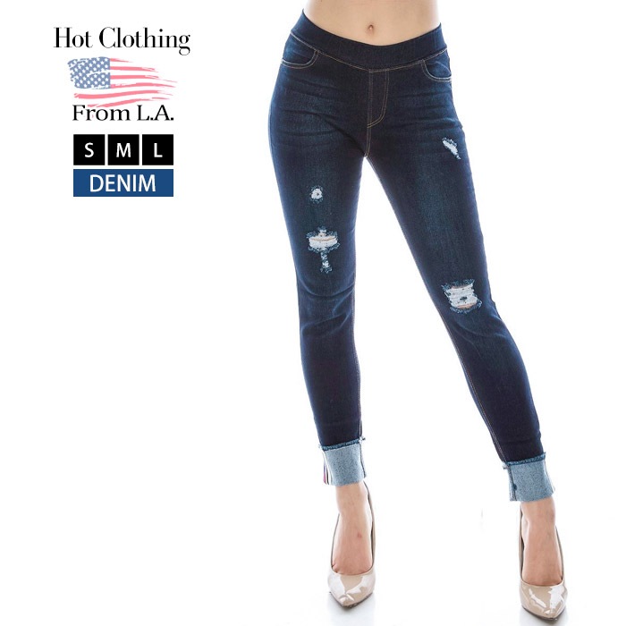 Pull-on jeggings with distress and bottoms are cuffed. Pants come 