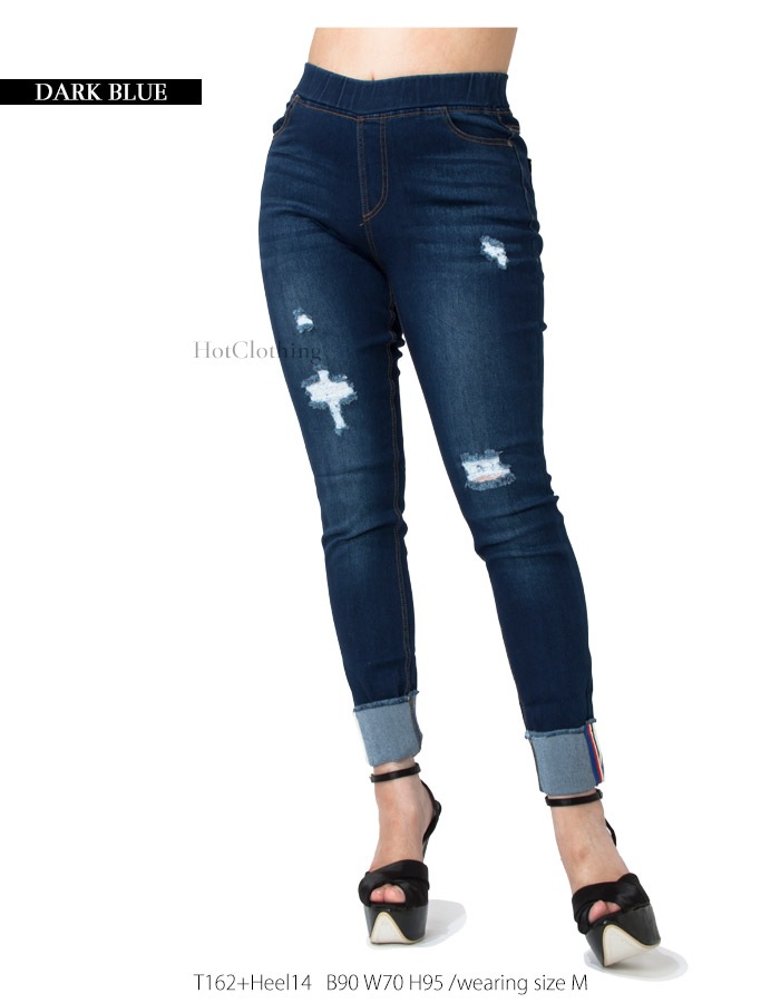Pull-on jeggings with distress and bottoms are cuffed. Pants come 