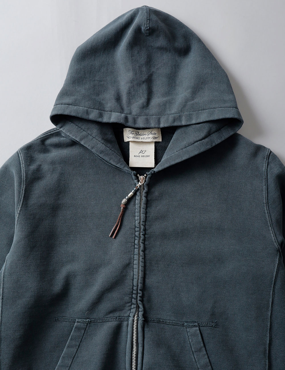 REMI RELIEF(レミレリーフ)SP加工 ジップアップパーカー