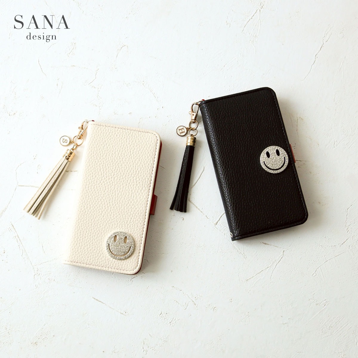 手帳型 キラキラ ニコちゃん タッセル付き 」AQUOSスマホケース ケース