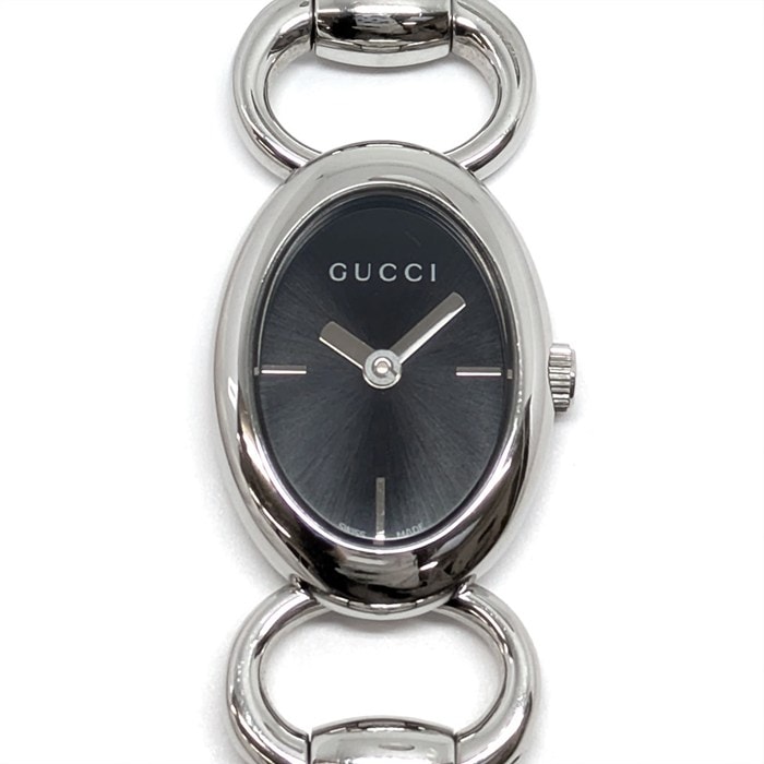 グッチ GUCCI 腕時計 トルナヴォーニ 118 ホースビット オーバル サンレイ ブラック文字盤 SS クオーツアナログ 【中古】