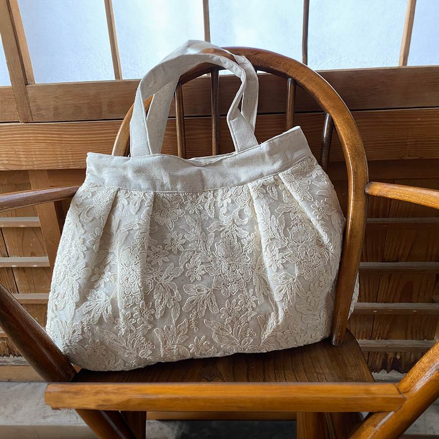 botany race ラウンドバッグ