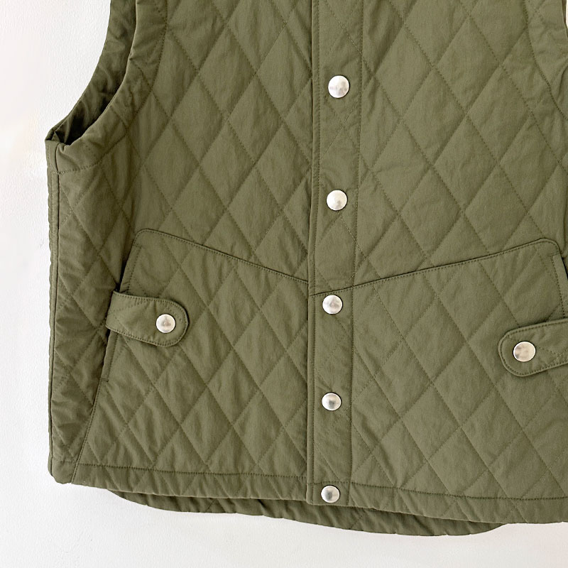 ティグルブロカンテ ナイロンツイルキルティング Hiネックスナップベスト unisex