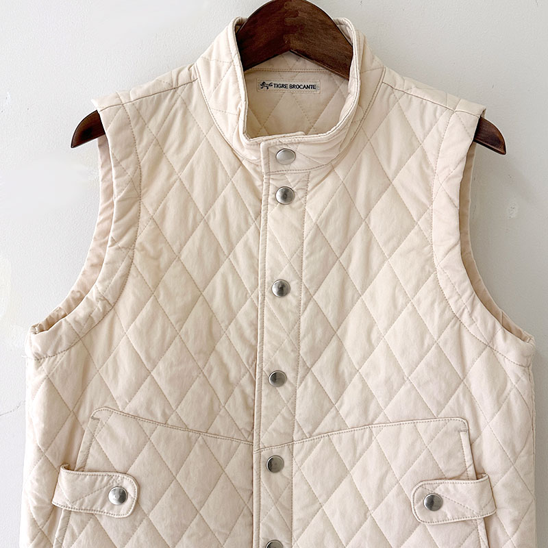 ティグルブロカンテ ナイロンツイルキルティング Hiネックスナップベスト unisex