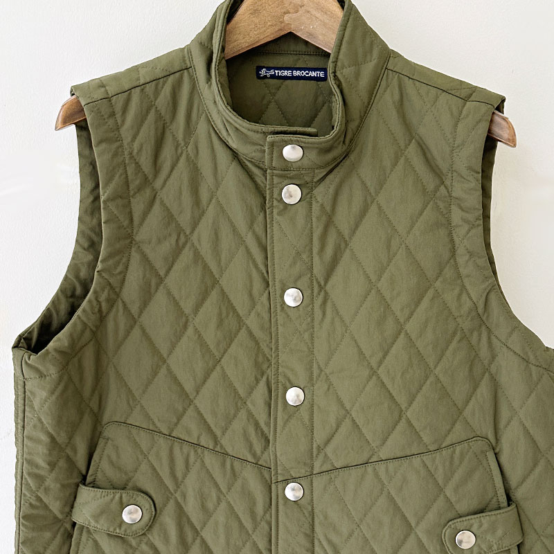 ティグルブロカンテ ナイロンツイルキルティング Hiネックスナップベスト unisex