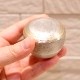 大き目の口径で安定した形状の高い品質の国内製分骨用骨壷　【手元供養用ミニ骨壷】カナタ（純銀色）
