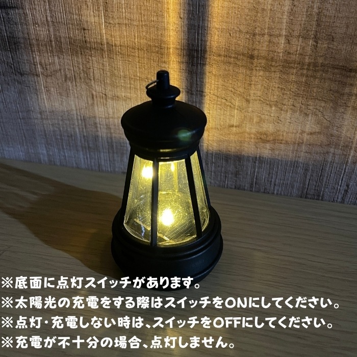 かわいい 置物 ソーラーランプを右手で持ち上げる黒ゴリラ グッズ