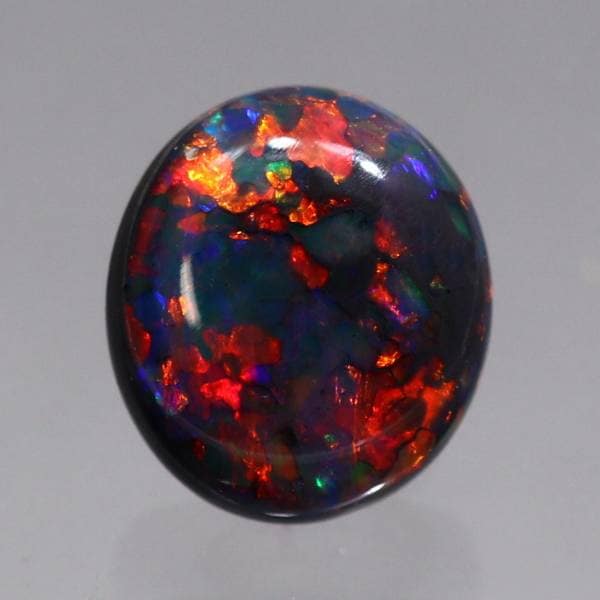 天然ブラックオパール 0.60ct 【レッド遊色】 両面