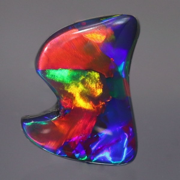 天然ブラックオパール 1.28ct 【赤斑・ローリングフラッシュ】 黒生地