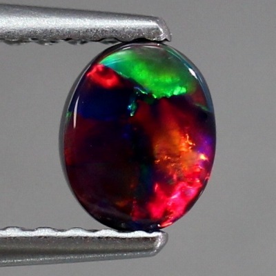 天然ブラックオパール 0.39ct 【黒生地・レッド遊色】