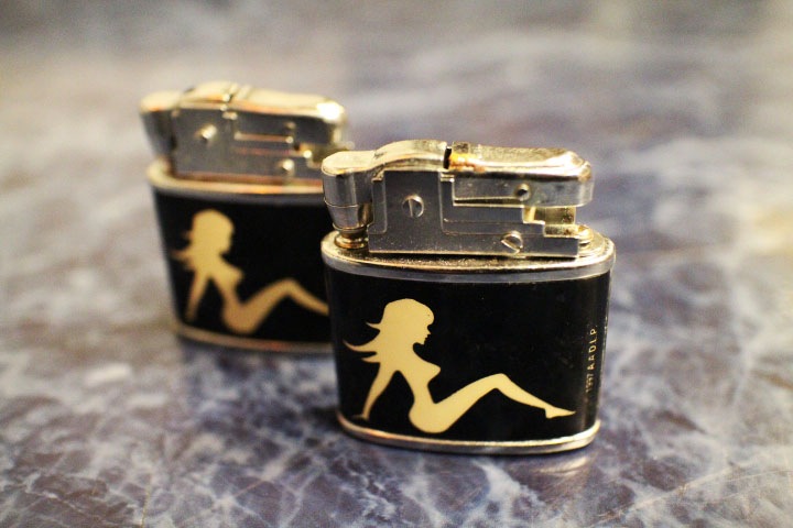 mud flap girl vintage oil lighter