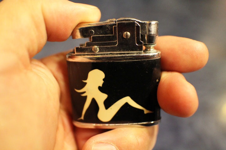 mud flap girl vintage oil lighter