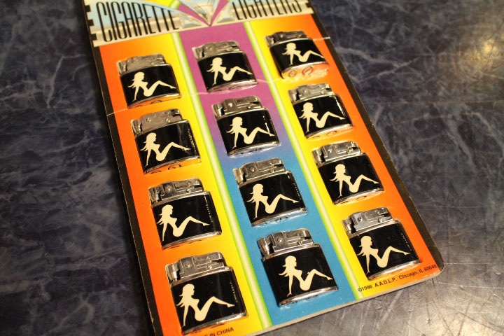 mud flap girl vintage oil lighter