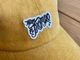 Tacos El Trompo cotton dad hat (script) / mustard 