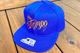 Tacos El Trompo snapback cap (script) / royal x orange